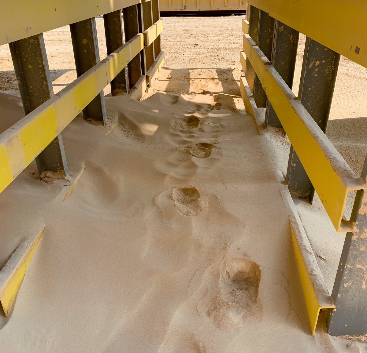 Material spillage from conveyors can quickly pile up
