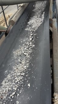 Material stuck to a conveyor belt is an expensive problem