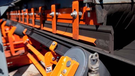 Keep conveyor systems precisely aligned in the load zone, increasing efficiency and preventing fugitive material.