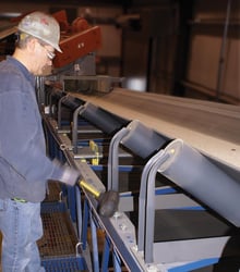 Knocking conveyor idlers is a method where an idler is manually moved to guide the belt back in line