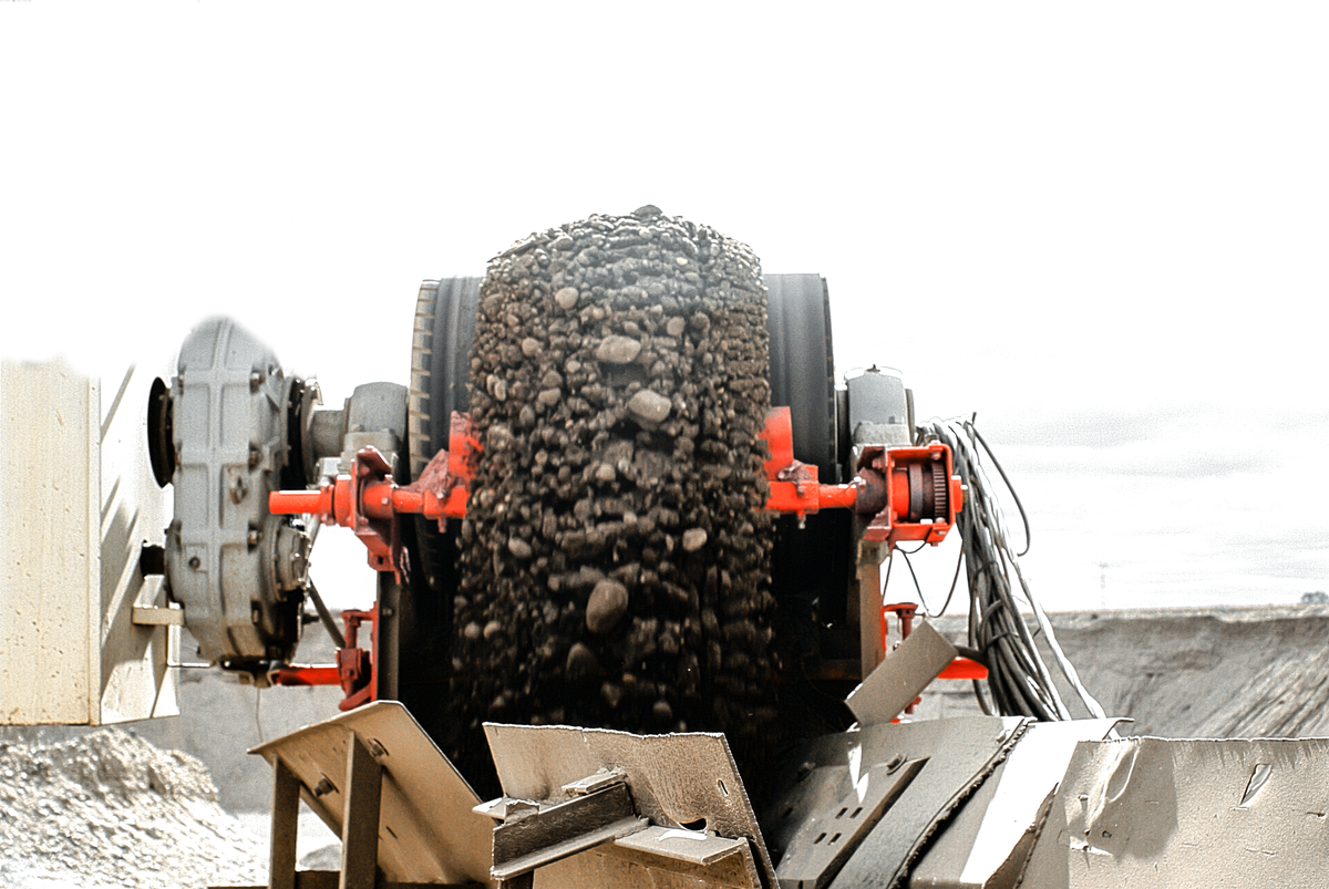 belt cleaners scrape material from the belt and return it to the material stream