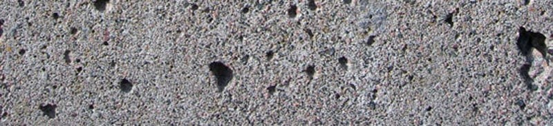 PrecastConcreteBugholesBugholes are caused by entrapped air bubbles that reach the surface but are not allowed to be released.