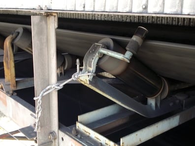 Tying off a conveyor idler is sometimes used to try to put the conveyor belt in line